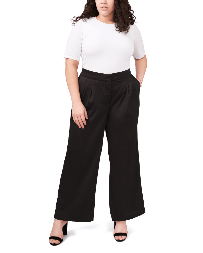 Front of a model wearing a size 1X Isla Satin Wide Leg Pant in 060-RICH BLACK by Vince Camuto. | dia_product_style_image_id:260891